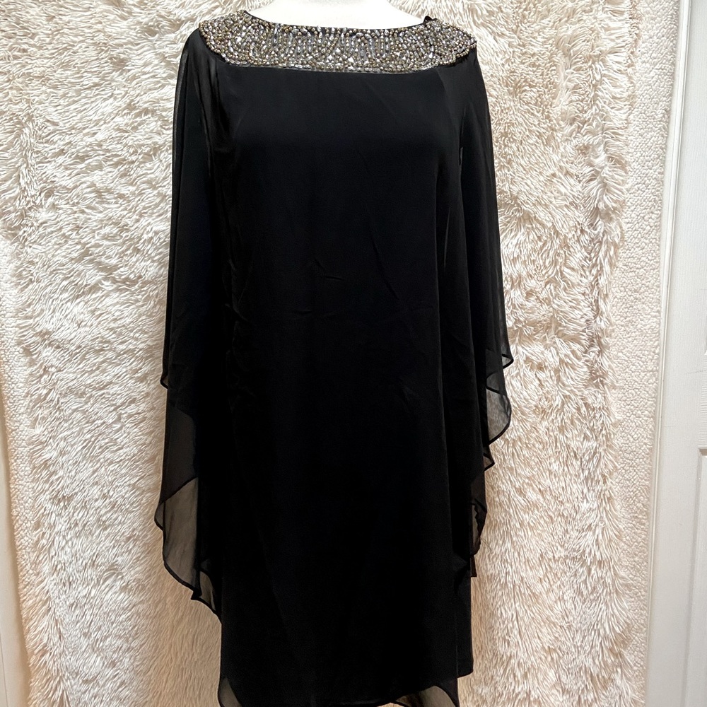 Black sheath dress with sheer cape